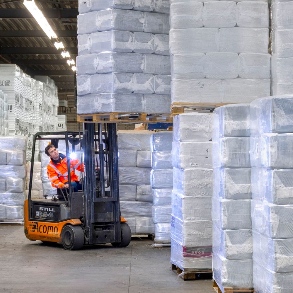 Acomo warehouse with acoustic spray materials ready for partner shipments